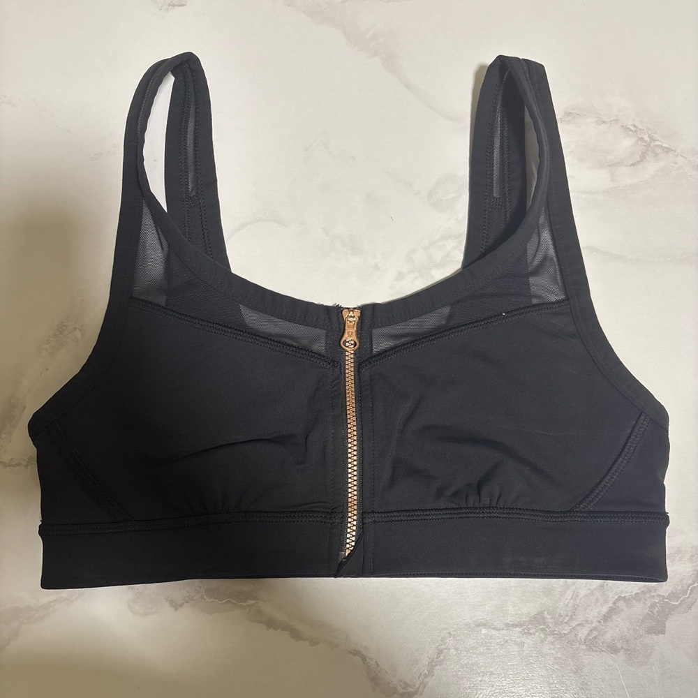 Black Lululemon Sports Bra with Gold Zipper and Mesh Details